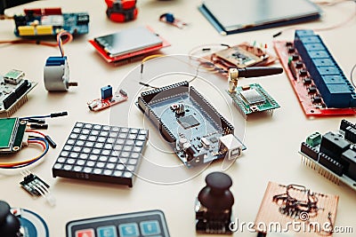 Boards and microcontrollers are on the table. STEM education for kid. Programming. Mathematics. The science. Stock Photo
