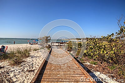 Boardwalk across the white sand beach of Delnor-Wiggins Pass Sta Editorial Stock Photo