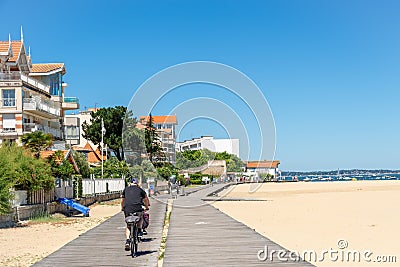 Arcachon, France. Boardwalk and bike path at seaside Editorial Stock Photo