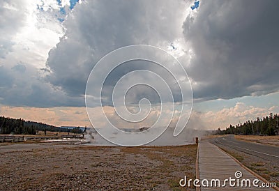 Boardwalk between Hot Lake hot spring and Firehole Lake drive in the Lower Geyser Basin in Yellowstone National Park in Wyoming US Stock Photo