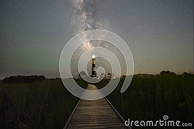 Boardwalk leading towards Bodie Island Lighthouse Stock Photo