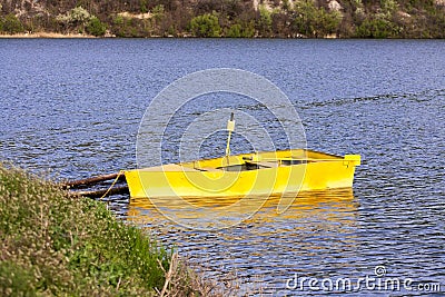 Boat anchored to the bank Stock Photo