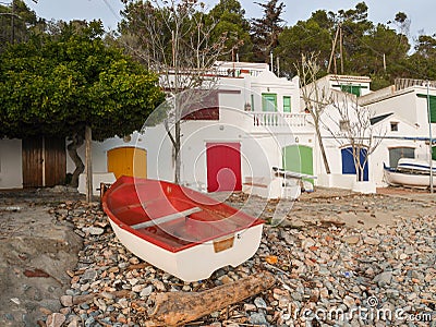 Boat at the beach, fishermen`s buildings Editorial Stock Photo