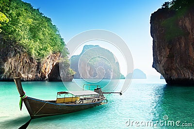 Boat on small island in Thailand Stock Photo