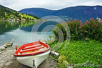 Boat on the beach of Olden. Stock Photo