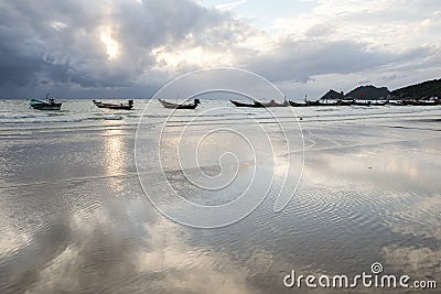 Boat on beach reflection in water Stock Photo