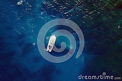 Boat in blue waters Stock Photo