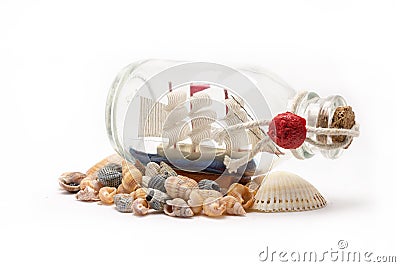 Boat in the bottle and sea shells on white background Stock Photo