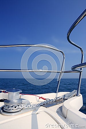 Boat bow sailing sea with anchor chain winch Stock Photo