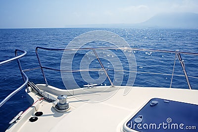 Boat bow sailing sea with anchor chain winch Stock Photo