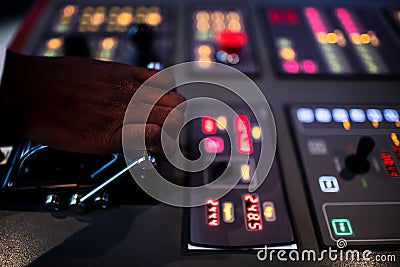 Boat captain hands navigating and moving instruments in the cockpit Stock Photo