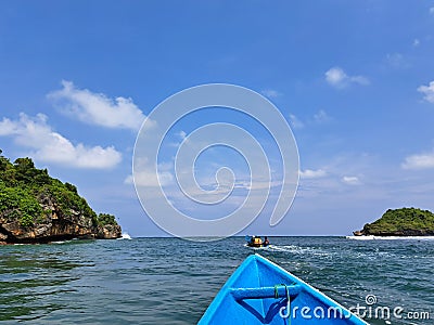 The boat crosses the river towards the sea Stock Photo