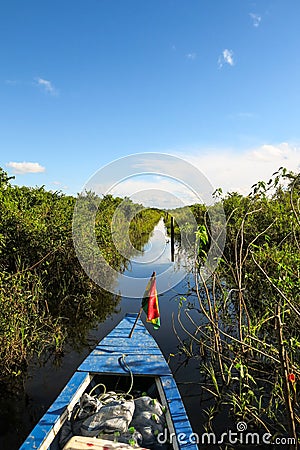 Boat Crossing the Amazon. Stock Photo