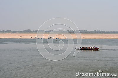 Boat Crossing the Ganges River in Varanasi, India Stock Photo