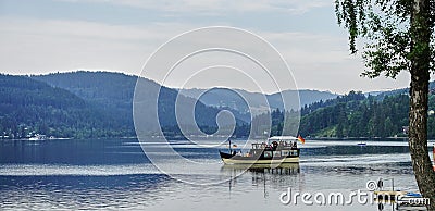 Boat cruising on Black Forest lake Titisee - Germany Editorial Stock Photo