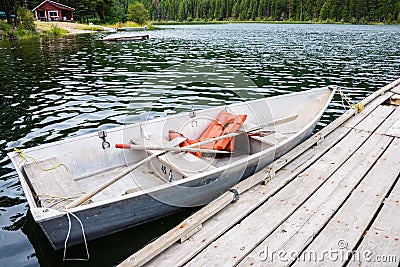 Boat at Dock in Lake Stock Photo