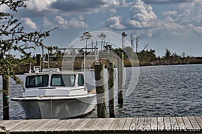Boat at the Dock, Manns Harbor, North Carolina Editorial Stock Photo