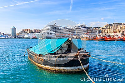 Boat in the fair harbor on background cruise ship in Italian harbor Genoa Editorial Stock Photo