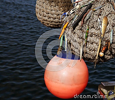 Boat fenders and fishing lures Stock Photo