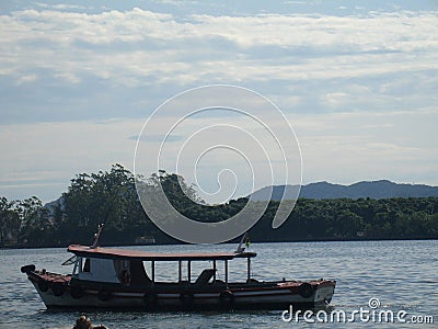 Boat fishing detail mountain sky Praia Grande Sao Paulo Brazil Stock Photo