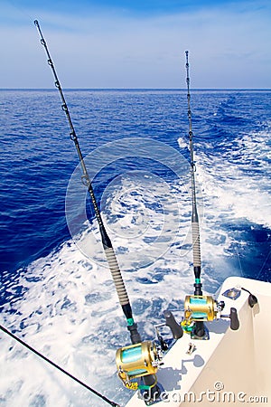 Boat fishing trolling in deep blue sea Stock Photo