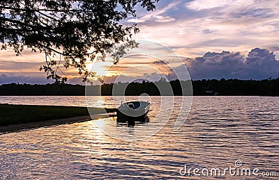 Boat floating peacefully on the waters of Silver Lake, Canada Stock Photo