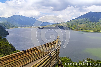 A boat in the foreground and a view of the lake and mountains in nature Stock Photo