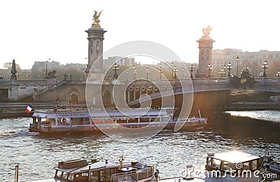 Boat going under a bridge. Paris, France Editorial Stock Photo