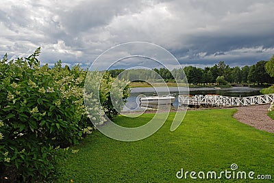 Boat at lake pier and clouds Stock Photo