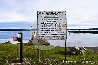 Boat launch sign providing information on cost for boaters and kayakers. Editorial Stock Photo