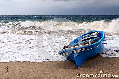 Boat at the mercy of the storm Stock Photo