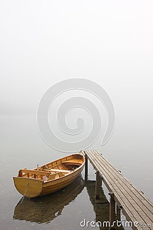 Boat on a misty morning Stock Photo