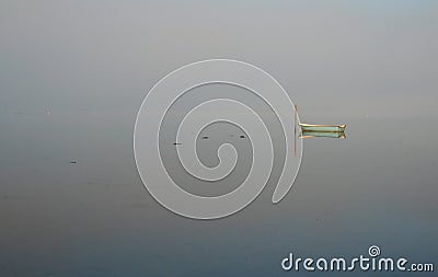 Boat in misty water Stock Photo