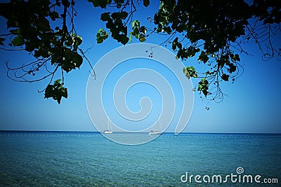 A boat moored with its sails retracted Stock Photo