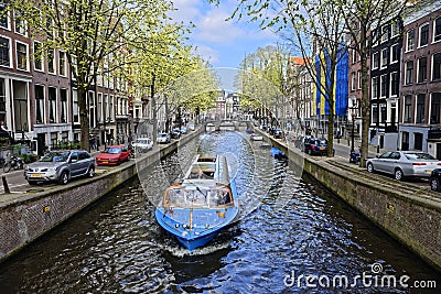 Boat on canal in Amsterdam Stock Photo