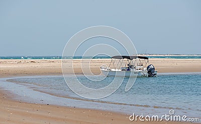 Boat near the sandy beach in Crystal Coast, North Carolina Editorial Stock Photo