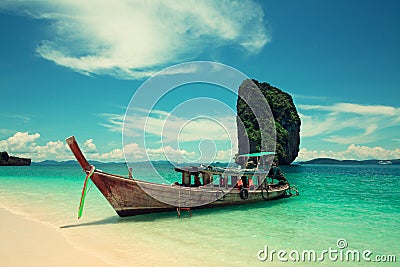 Boat near the sandy beach. Stock Photo