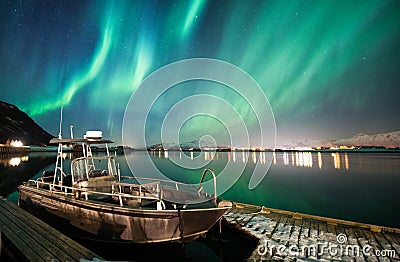 Boat with northern lights background Stock Photo