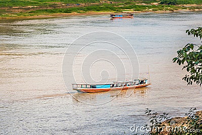 Boat offshore Nam Khan river, Luang Prabang, Laos. Copy space for text. Editorial Stock Photo