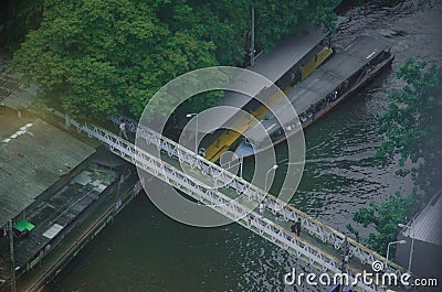 Boat parked at a dock in a canal in Bangkok Editorial Stock Photo