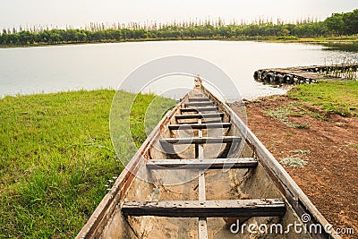 Boat parking at the coast into the lake at dawn Stock Photo