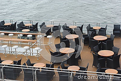 Boat restaurant tables and chairs on deck Stock Photo