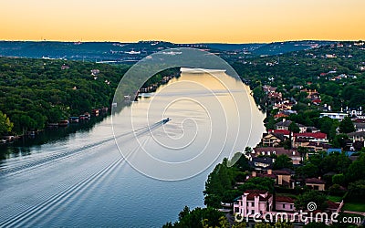 Boat riding across the water Austin Texas Colorado river bend Stock Photo