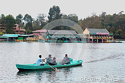 Boat riding a family at the kodaikanal lake near the boat house. Editorial Stock Photo