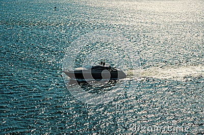 Boat sail on silver sea water waves in Miami, USA Stock Photo