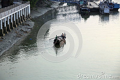 A boat sails on the Hooghly River in Kolkata Stock Photo