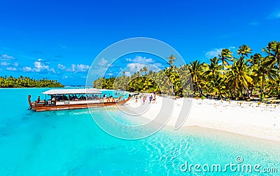 Boat on a sandy beach in Aitutaki island, Cook Islands, South Pacific. Copy space for text Editorial Stock Photo