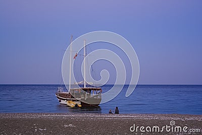 Boat Sea seated person with child sailboat Stock Photo