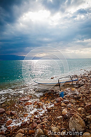 Boat on the shore of the Dead sea in Israel Stock Photo