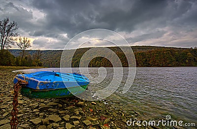 A boat on the shore of Lake Solina Stock Photo